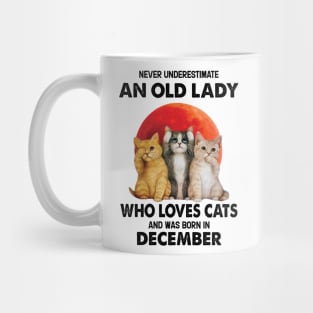 Never Underestimate An Old Lady Who Loves Cats And Was Born In December Mug